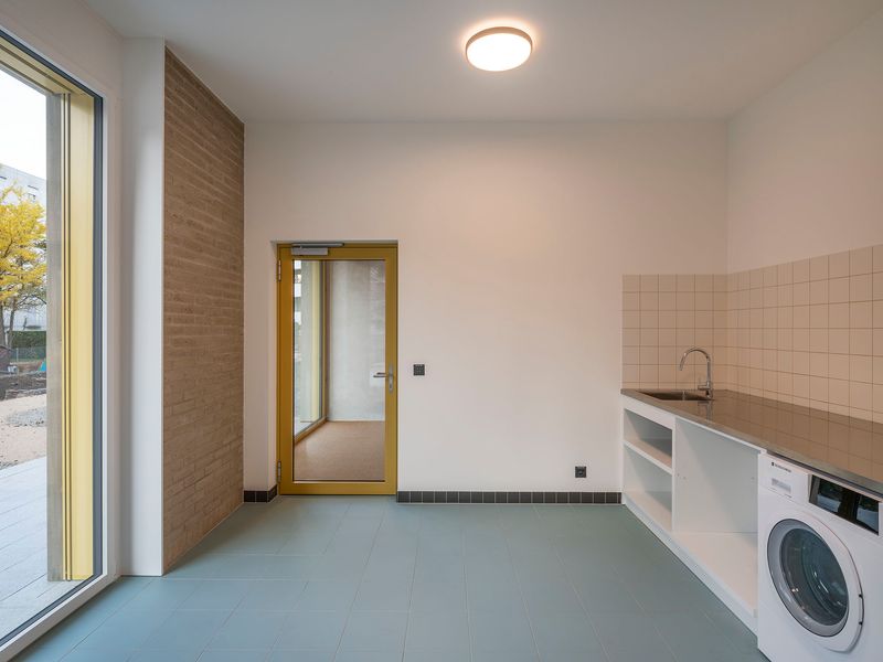 Immeuble de logements coopératifs, PSBL et PPE – Buanderie commune située au rez-de-chaussée côté jardin – Johannes Marburg Photography