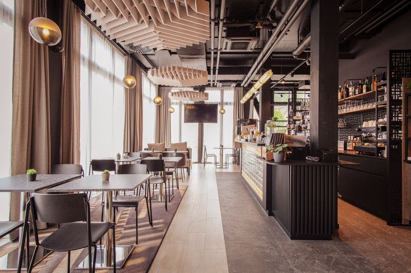 Hôtâ Hôtel St-Imier – Espace petit déjeuner et café-bar – ©GINAA architectes Sàrl